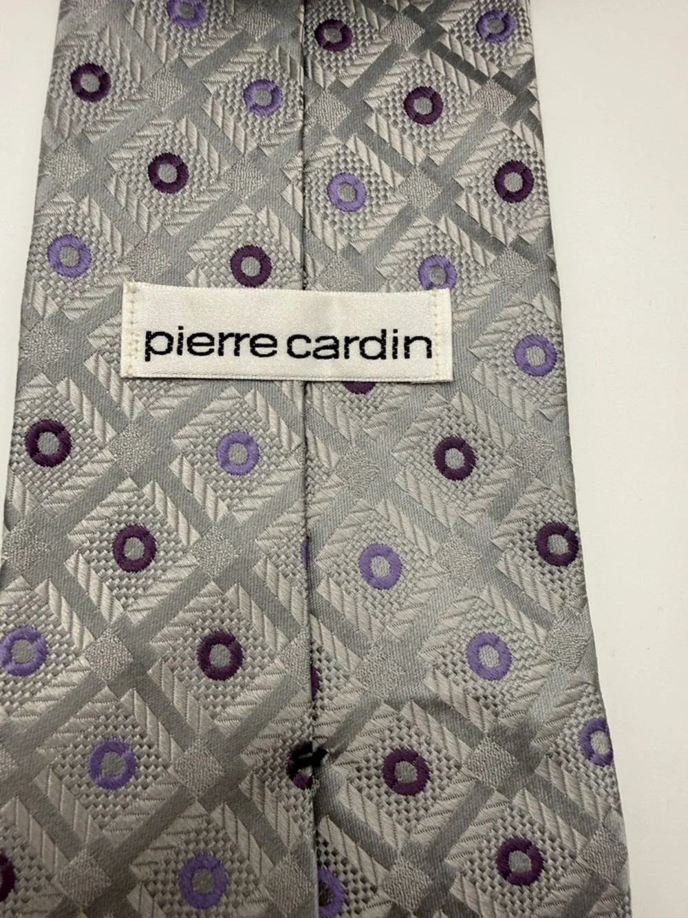 Pierre Cardin tie in a silver and purple geometric pattern. 100% silk.